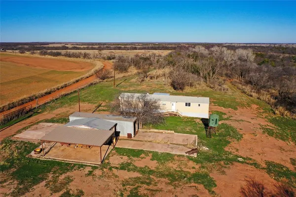 an aerial view of a house with a outdoor space