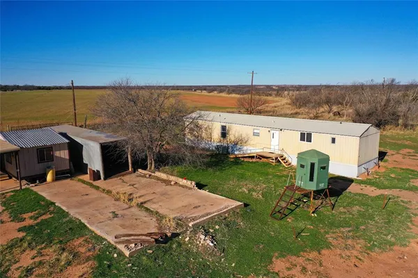 an aerial view of a house having yard