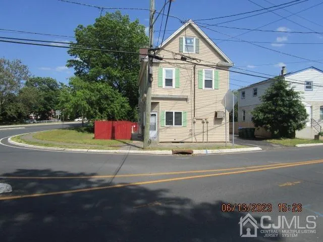 a view of white house with a street