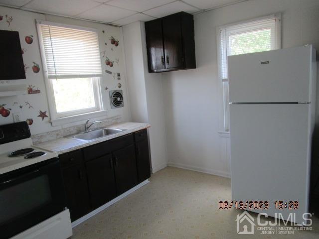 17 Player Avenue Edison, NJ 08817 - Photo 3 of 10 a kitchen with a refrigerator and a sink