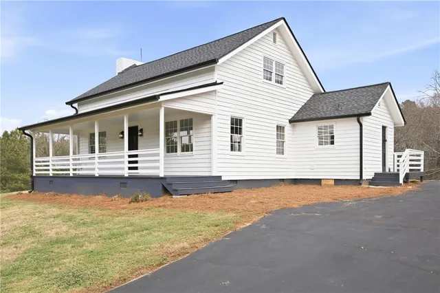 a front view of a house with swimming pool