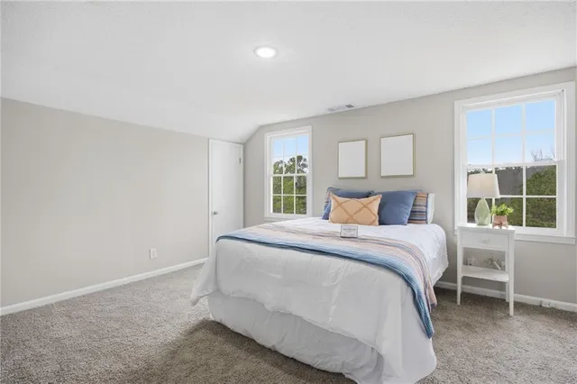 a bathroom with a toilet a sink and a mirror