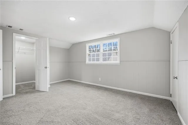 a view of a field with a tree