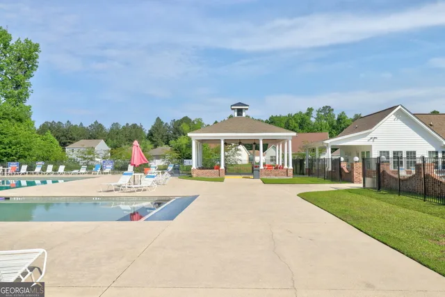 a front view of house with yard outdoor seating and green space