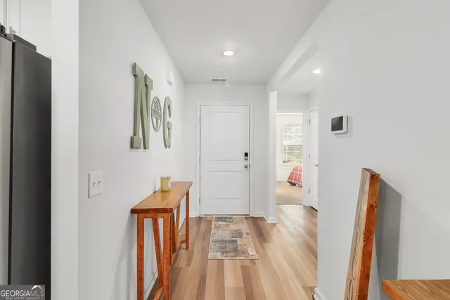 a view of entryway with wooden floor