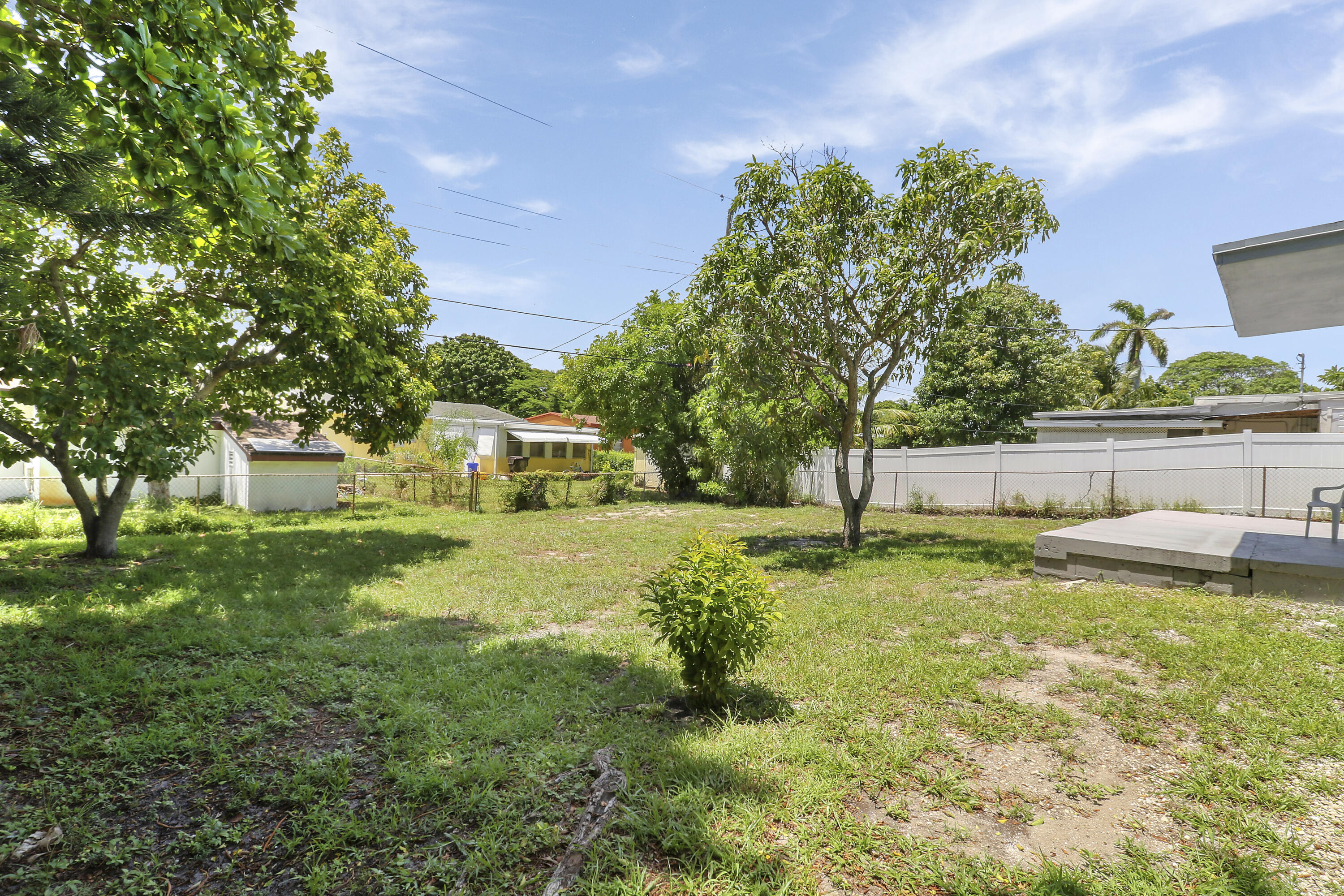 5519 Columbus Road West Palm Beach, FL 33405 - Photo 15 of 22 a view of a house with a yard