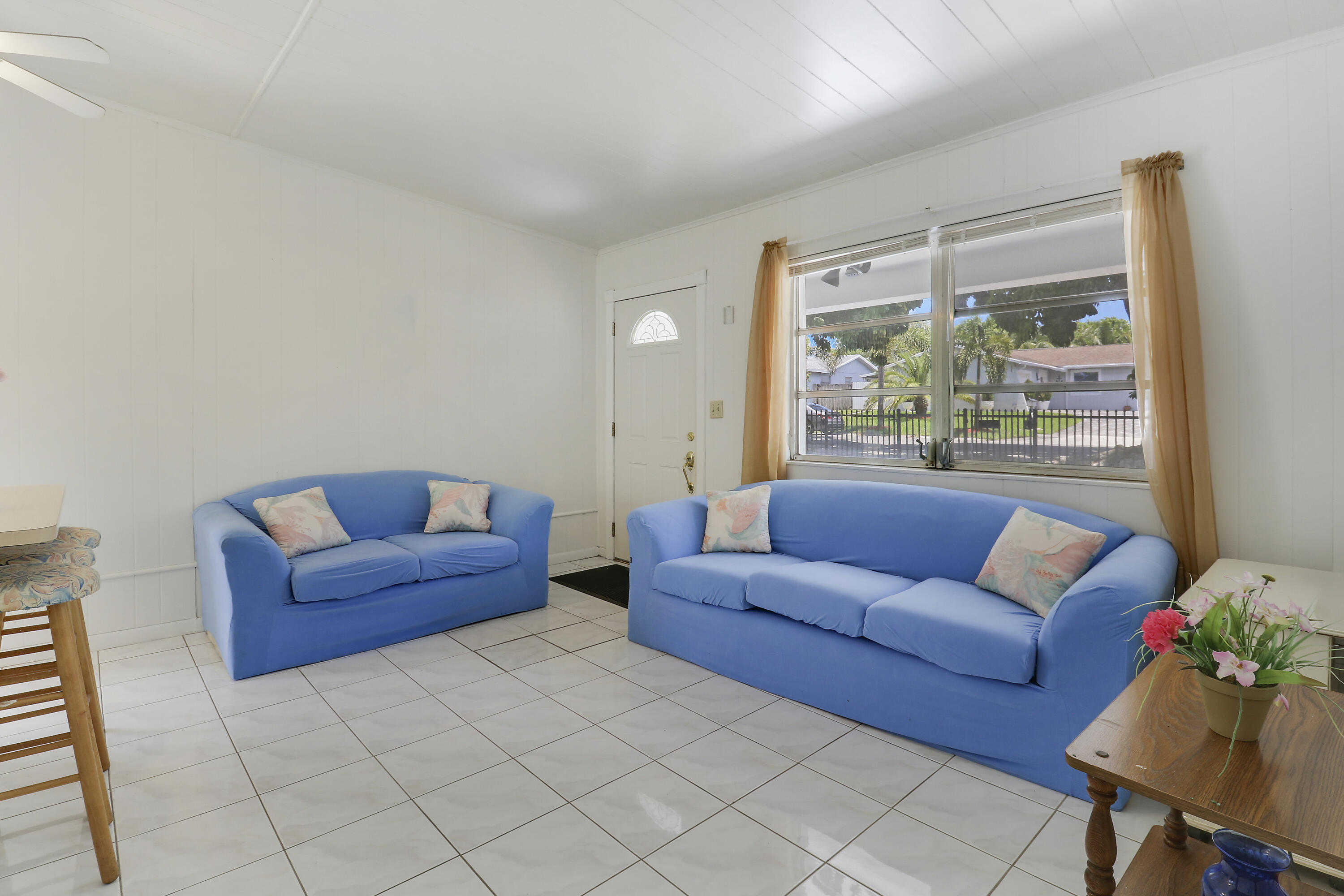 5519 Columbus Road West Palm Beach, FL 33405 - Photo 3 of 22 a living room with furniture and a large window