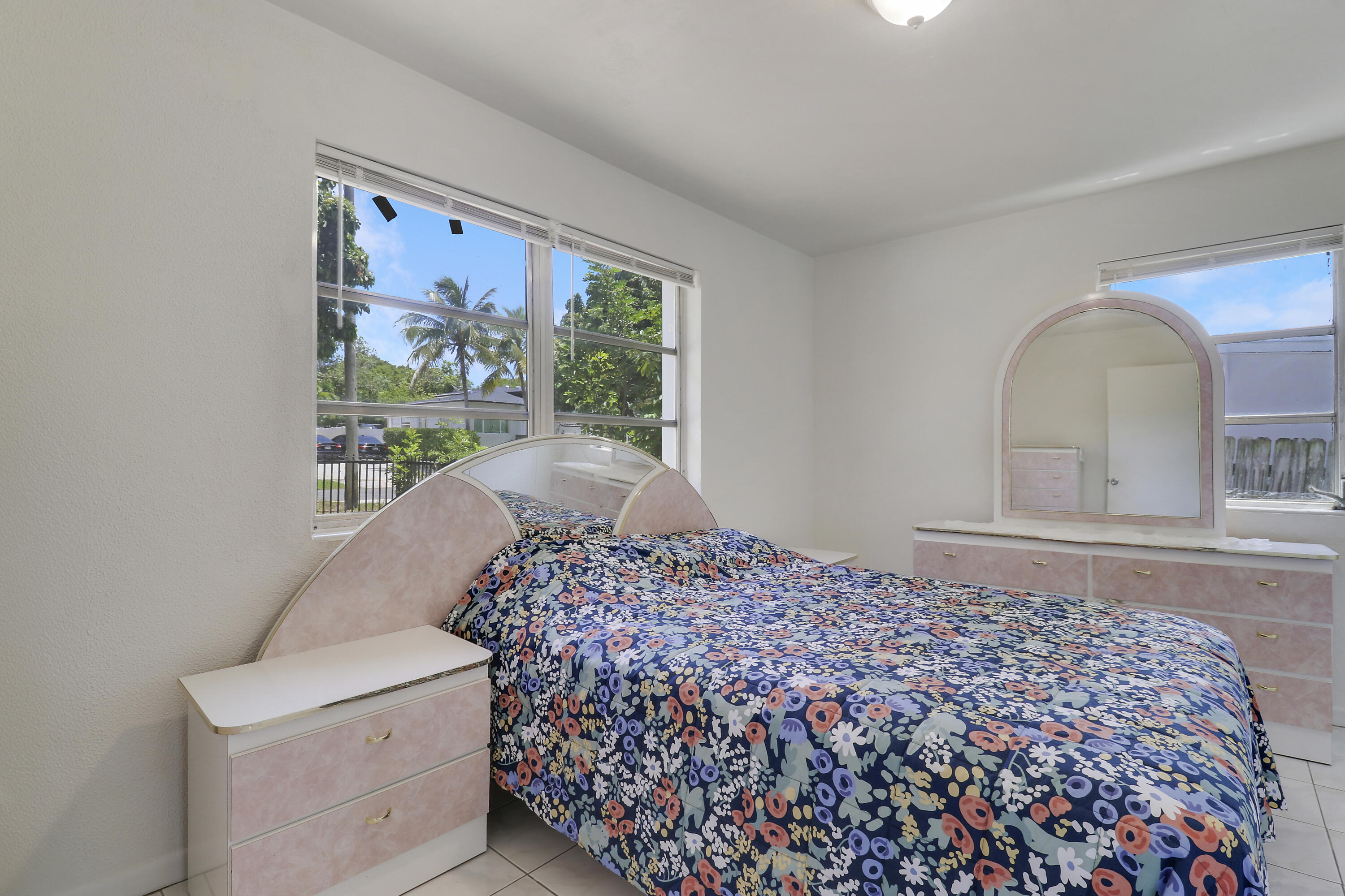 5519 Columbus Road West Palm Beach, FL 33405 - Photo 7 of 22 a bedroom with a bed and a painting on the wall
