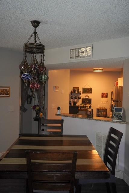 8871 Wiles Road, Unit 201 Coral Springs, FL 33067 - Photo 22 of 70 a view of a living room with furniture and a chandelier