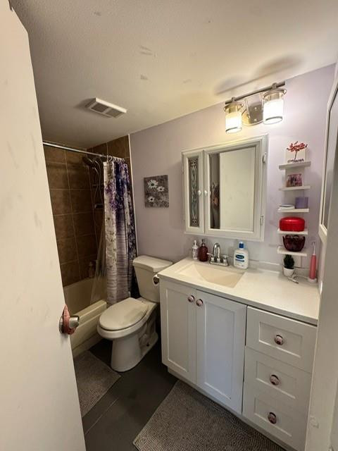 8871 Wiles Road, Unit 201 Coral Springs, FL 33067 - Photo 30 of 70 a bathroom with a double vanity sink toilet and mirror