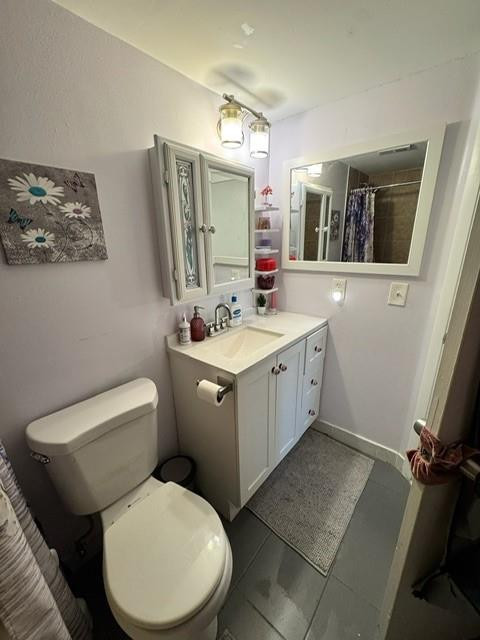 8871 Wiles Road, Unit 201 Coral Springs, FL 33067 - Photo 31 of 70 a bathroom with a toilet sink and mirror