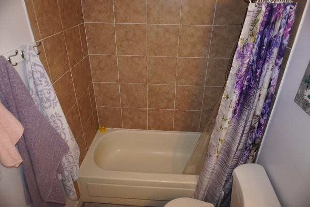 8871 Wiles Road, Unit 201 Coral Springs, FL 33067 - Photo 32 of 70 a bathroom with a bathtub and a toilet