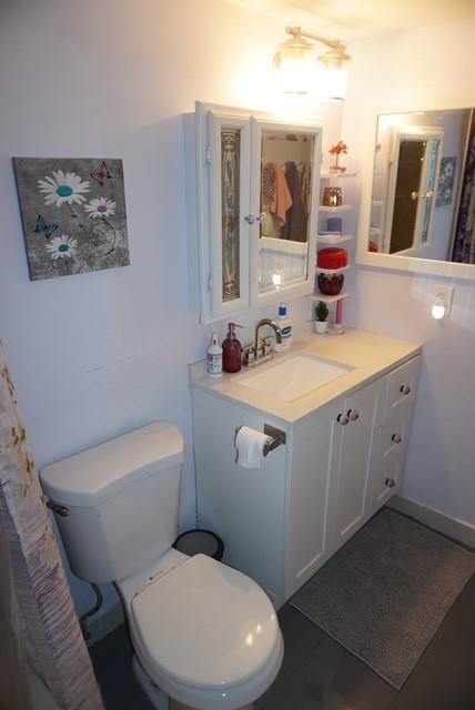 8871 Wiles Road, Unit 201 Coral Springs, FL 33067 - Photo 35 of 70 a white toilet sitting next to a bathroom sink