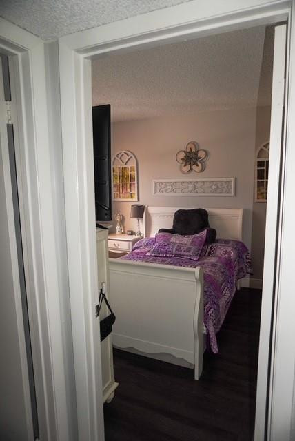 8871 Wiles Road, Unit 201 Coral Springs, FL 33067 - Photo 41 of 70 a bed room with a bed and a mirror