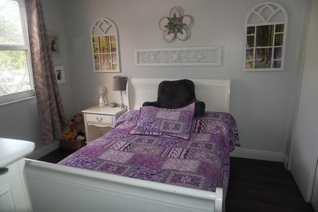 8871 Wiles Road, Unit 201 Coral Springs, FL 33067 - Photo 43 of 70 a large bed sitting in a bedroom next to a window