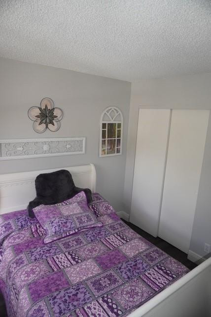 8871 Wiles Road, Unit 201 Coral Springs, FL 33067 - Photo 47 of 70 a bedroom with a bed and dresser
