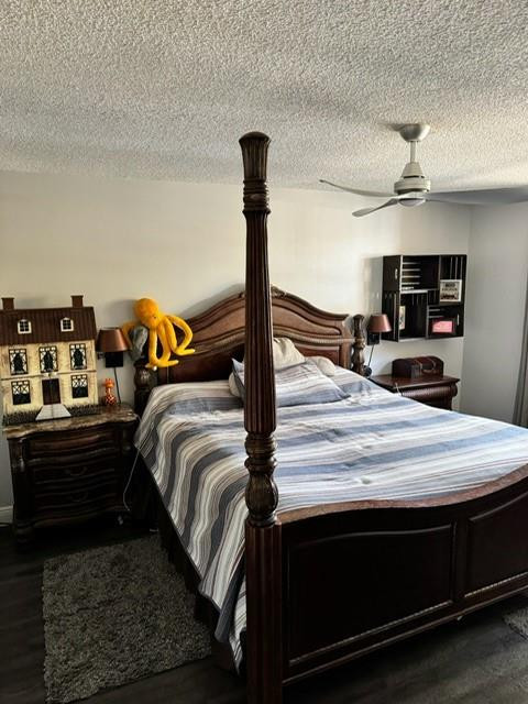 8871 Wiles Road, Unit 201 Coral Springs, FL 33067 - Photo 55 of 70 a bed sitting in a bedroom and dressers next to a window