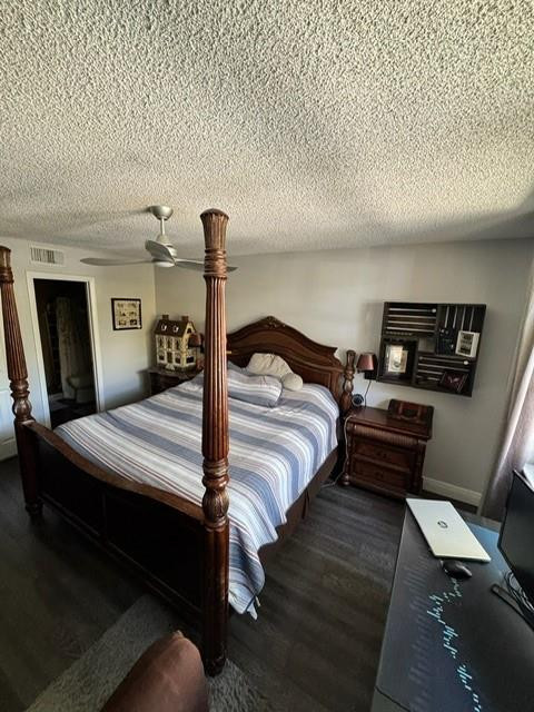 8871 Wiles Road, Unit 201 Coral Springs, FL 33067 - Photo 56 of 70 a bedroom with a bed and wooden floor