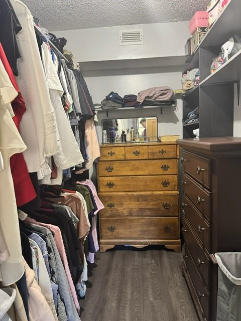 8871 Wiles Road, Unit 201 Coral Springs, FL 33067 - Photo 61 of 70 a view of walk in closet with clothes and shoes