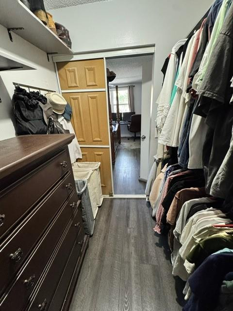 8871 Wiles Road, Unit 201 Coral Springs, FL 33067 - Photo 65 of 70 a view of walk in closet with clothes and shoes