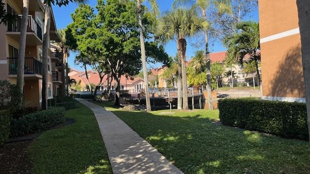 8871 Wiles Road, Unit 201 Coral Springs, FL 33067 - Photo 8 of 70 a view of a building with a yard