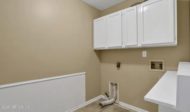 a view of room with cabinets