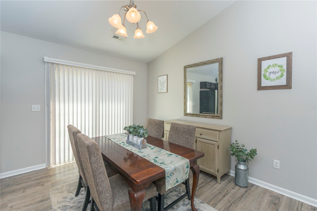 158 Mediterranean Avenue Anderson, SC 29621 - Photo 7 of 39 This inviting dining area features a sliding glass door and durable flooring, perfect for gatherings.