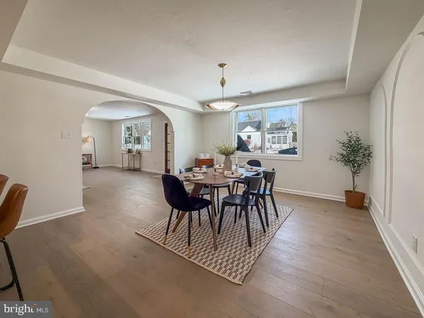 a view of a dining room with furniture and window