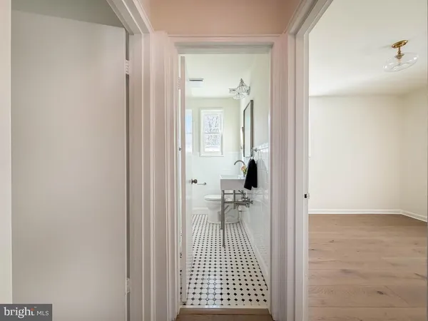a view of a bathroom from a hallway