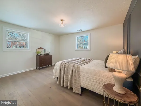 a bedroom with a bed and lamp