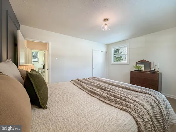 a bedroom with a bed and closet