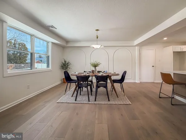 a view of a dining room with furniture and window