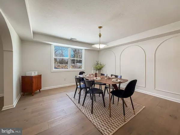 a view of a dining room with furniture and window