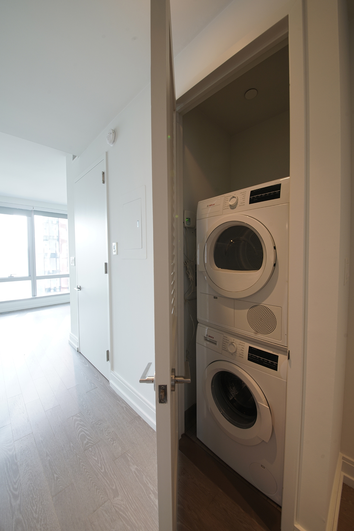 555 10th Avenue, Unit 41M Manhattan, NY 10018 - Photo 6 of 20 a utility room with dryer and washer