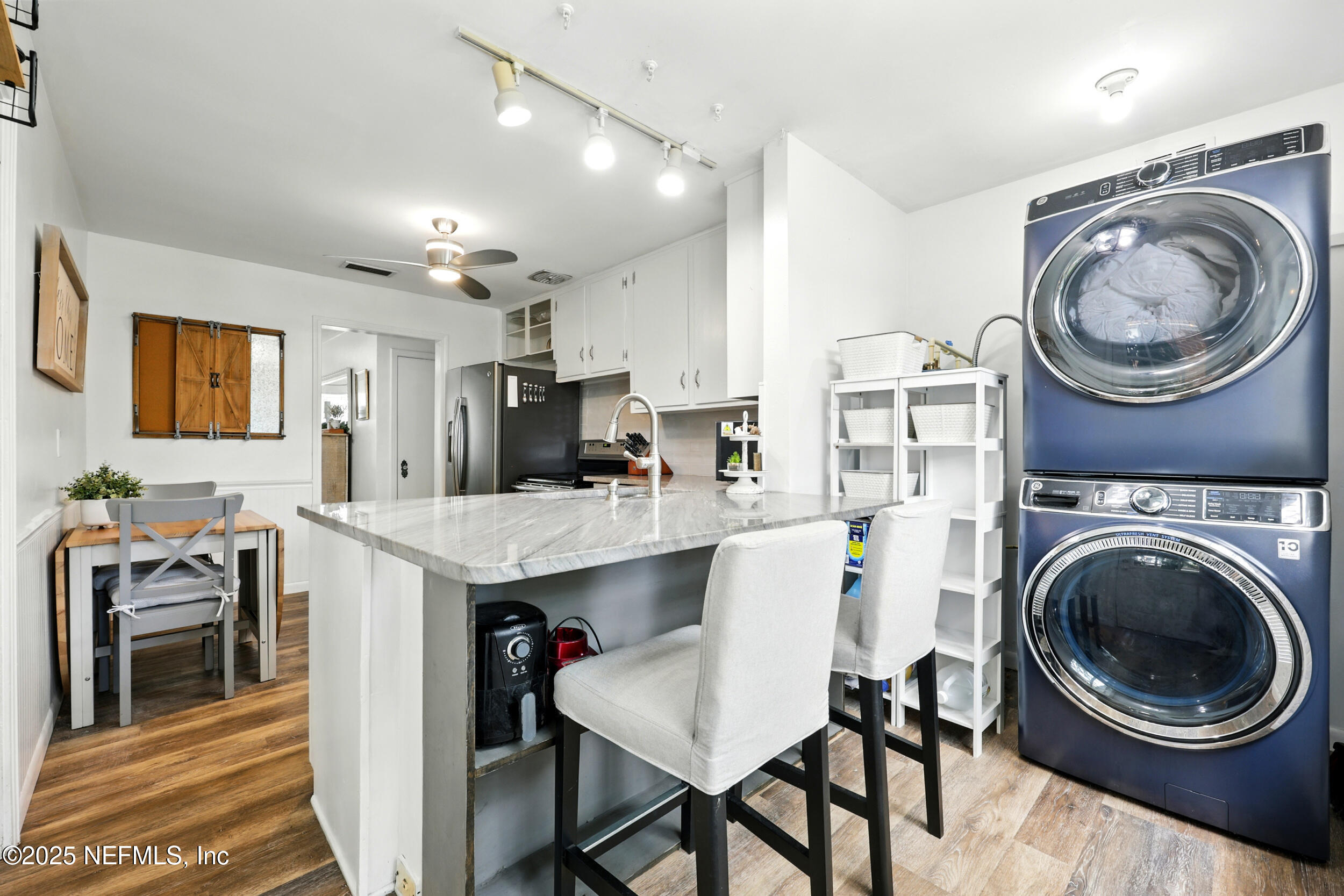 6414 Colgate Road Jacksonville, FL 32217 - Photo 11 of 33 a view of a kitchen with a sink a washer and dryer