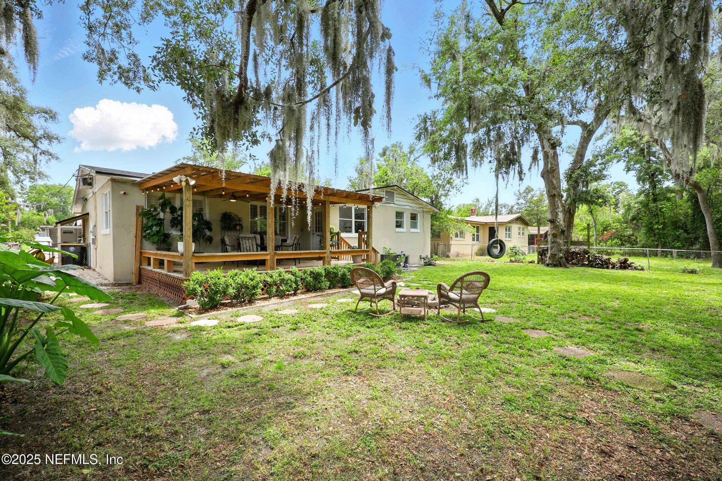 6414 Colgate Road Jacksonville, FL 32217 - Photo 31 of 33 a view of a house with backyard and sitting area