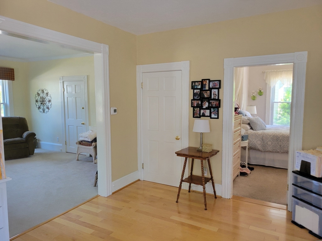 40 June Street Worcester, MA 01602 - Photo 14 of 28 a bedroom with furniture and a wooden floor