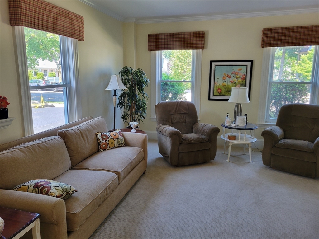 40 June Street Worcester, MA 01602 - Photo 17 of 28 a living room with furniture and a large window