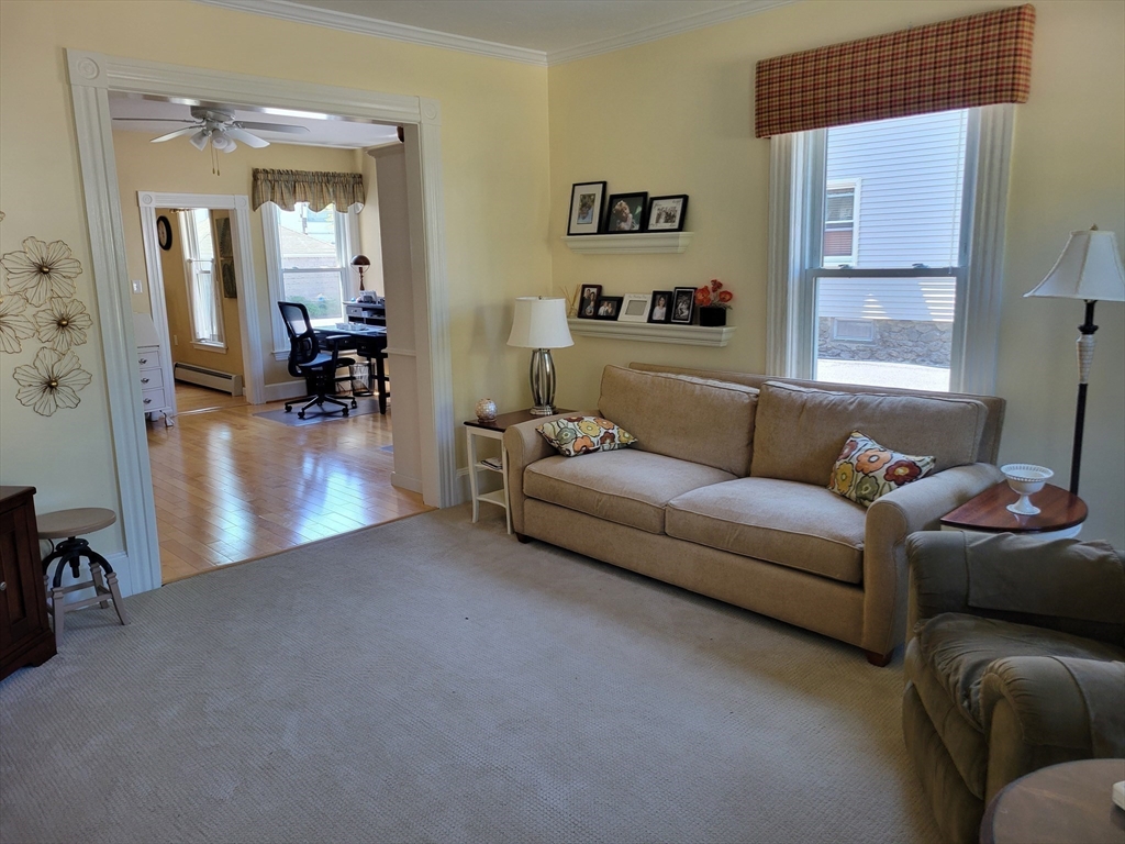 40 June Street Worcester, MA 01602 - Photo 18 of 28 a living room with furniture and a flat screen tv