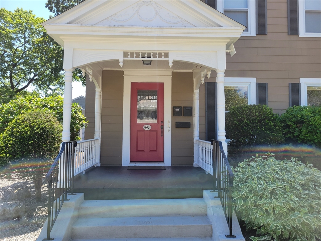 40 June Street Worcester, MA 01602 - Photo 2 of 28 a front view of a house with a yard