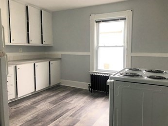 40 June Street Worcester, MA 01602 - Photo 23 of 28 a room with a stove and a window