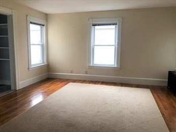 40 June Street Worcester, MA 01602 - Photo 27 of 28 an empty room with wooden floor and windows