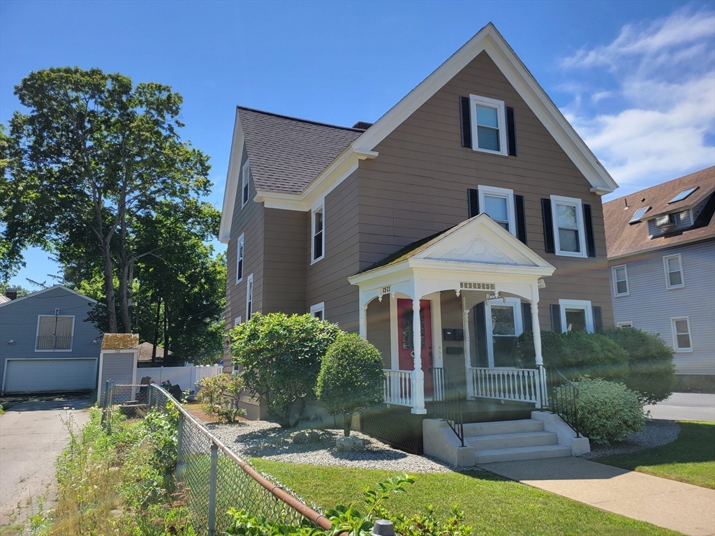 40 June Street Worcester, MA 01602 - Photo 3 of 28 a front view of a house with garden