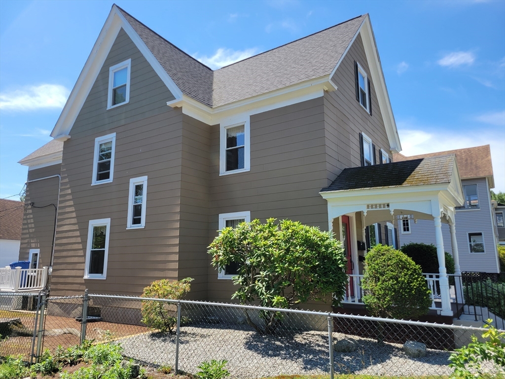 40 June Street Worcester, MA 01602 - Photo 4 of 28 a front view of a house with a yard