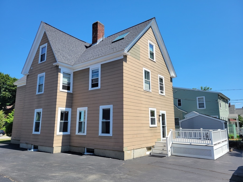 40 June Street Worcester, MA 01602 - Photo 5 of 28 a front view of a house with a garage