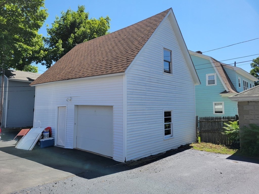 40 June Street Worcester, MA 01602 - Photo 6 of 28 a view of a house with a backyard