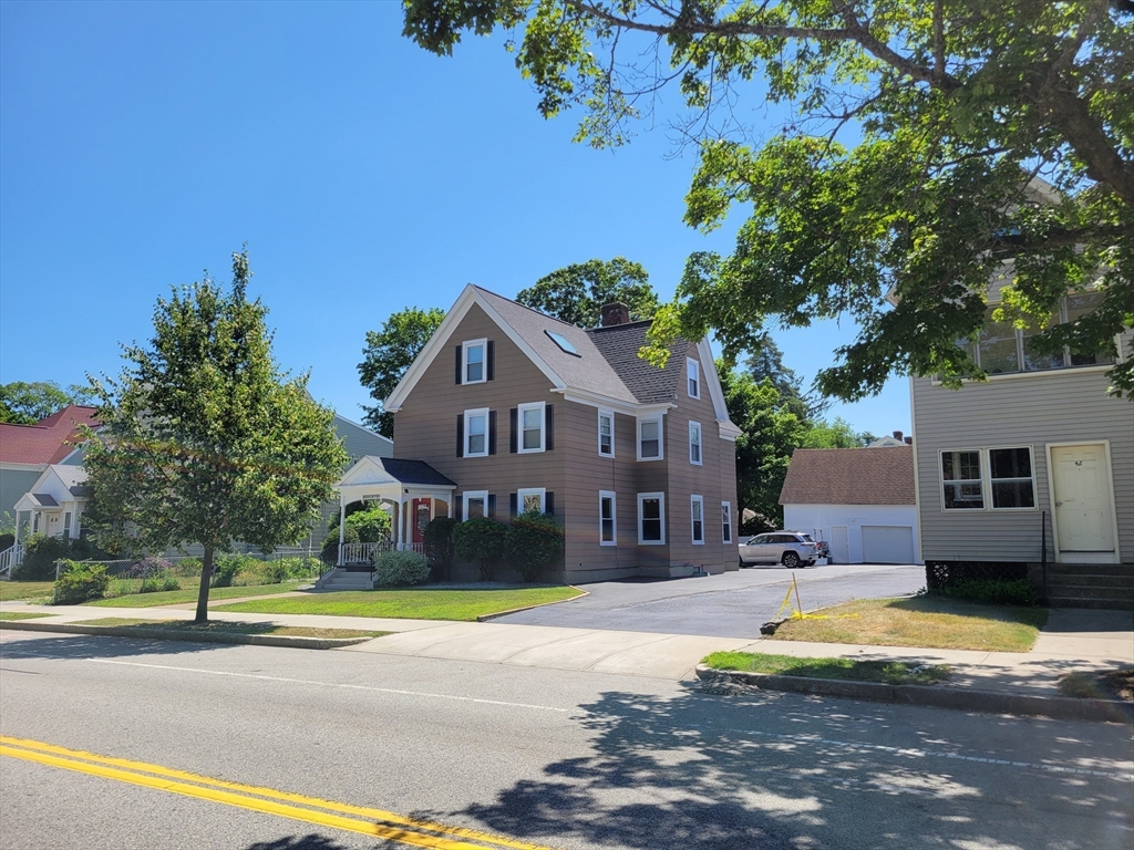 40 June Street Worcester, MA 01602 - Photo 8 of 28 a front view of a house with a yard