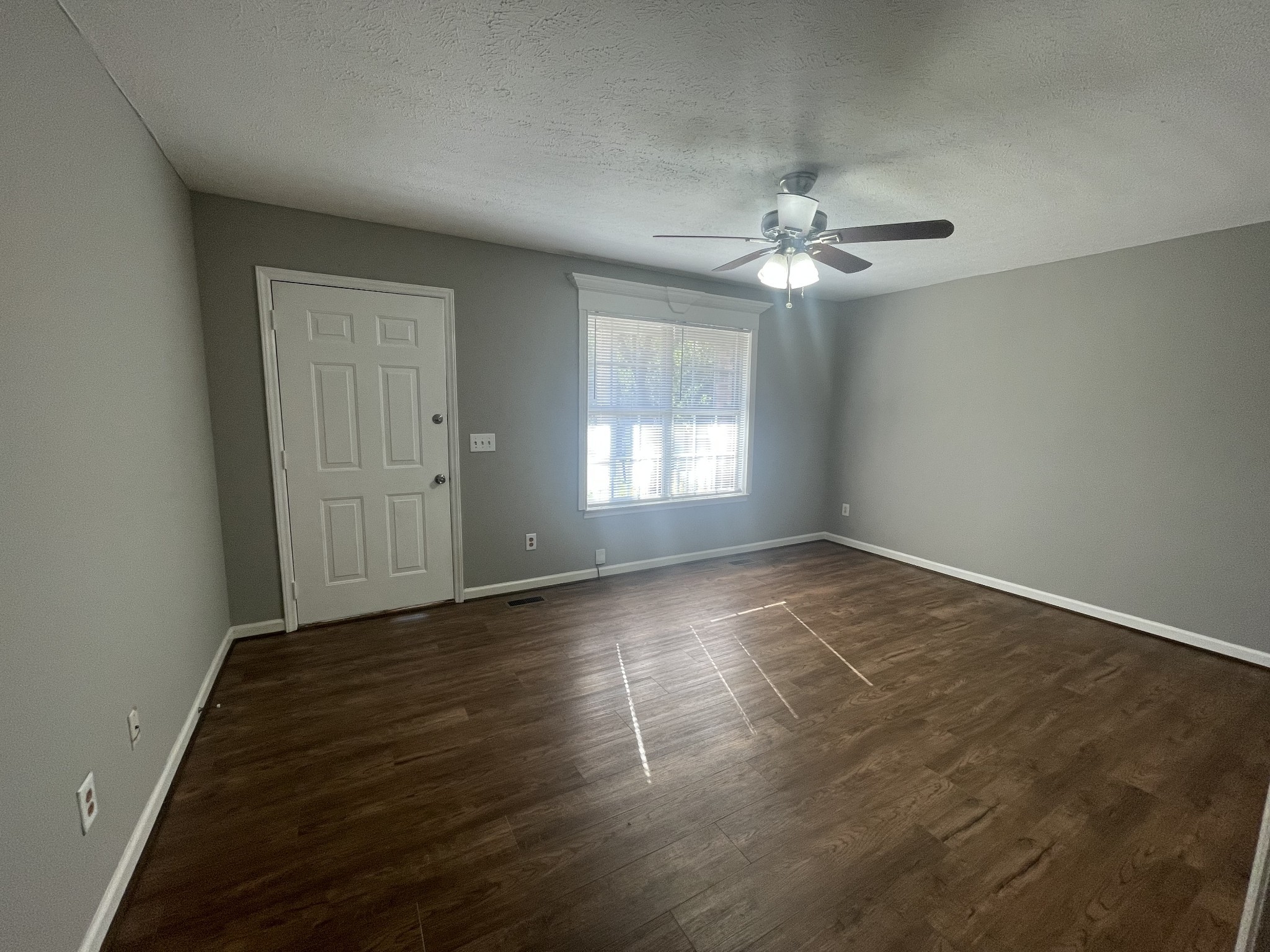 2505 Tinnell Court, Unit 2505 Murfreesboro, TN 37129 - Photo 2 of 11 an empty room with wooden floor and windows