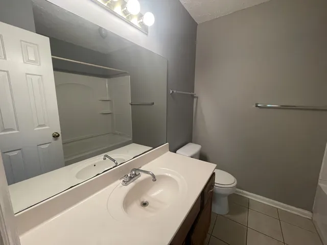 a bathroom with a sink and a toilet