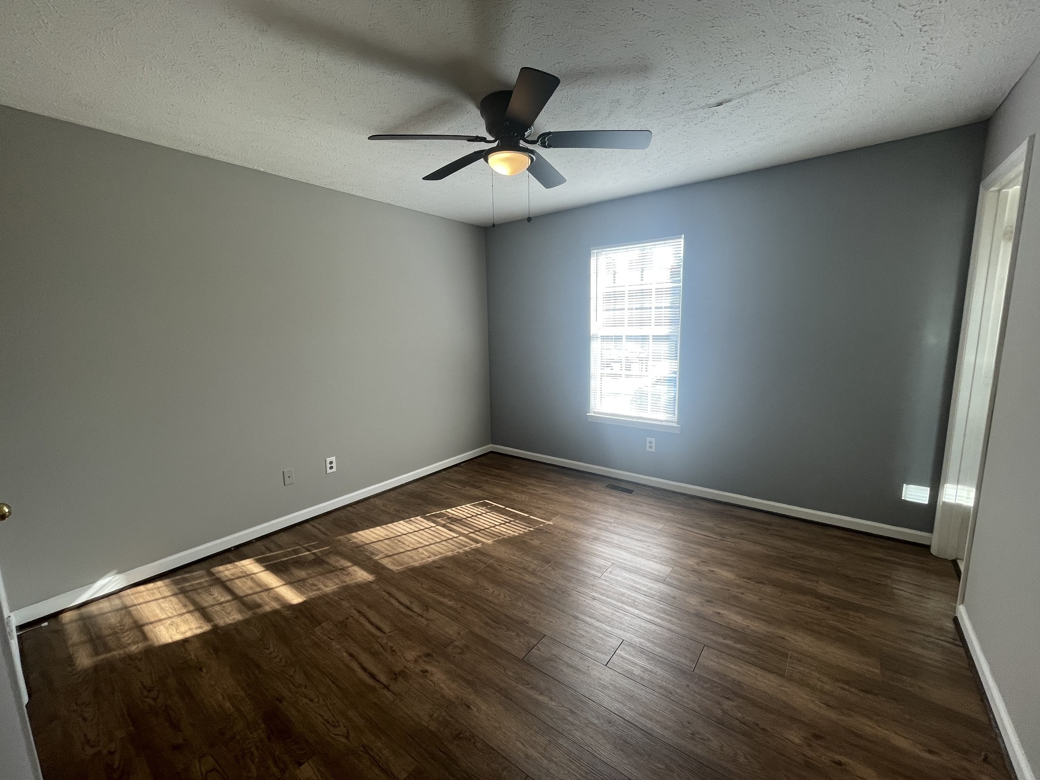 2505 Tinnell Court, Unit 2505 Murfreesboro, TN 37129 - Photo 7 of 11 a view of empty room with wooden floor and fan